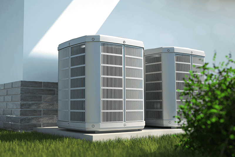 Two outdoor HVAC systems on side of house.